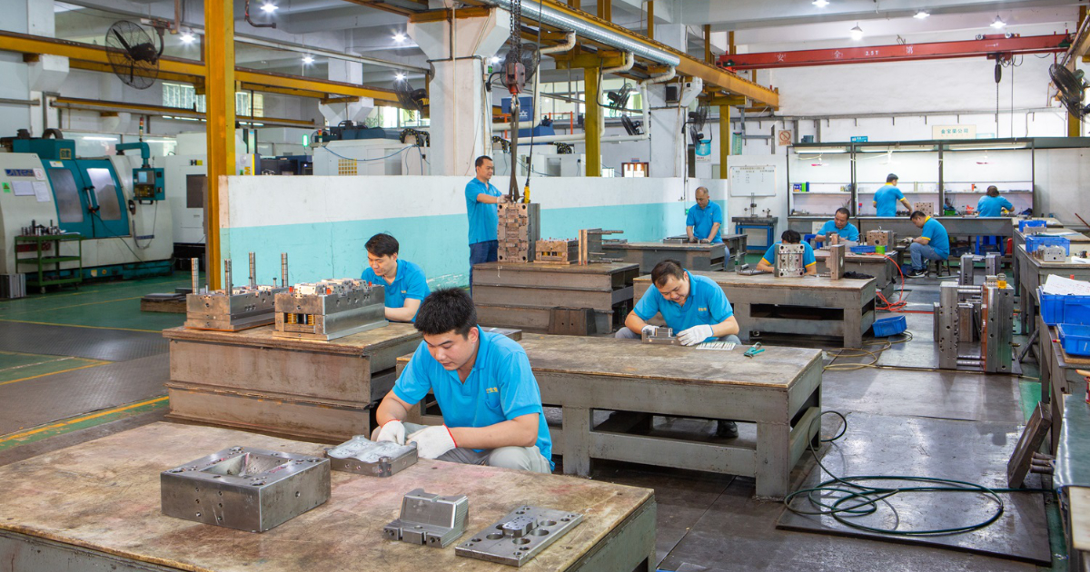 Mold assembly workshop overview at JBRplas Shenzhen — multiple assembly bays for concurrent mold builds