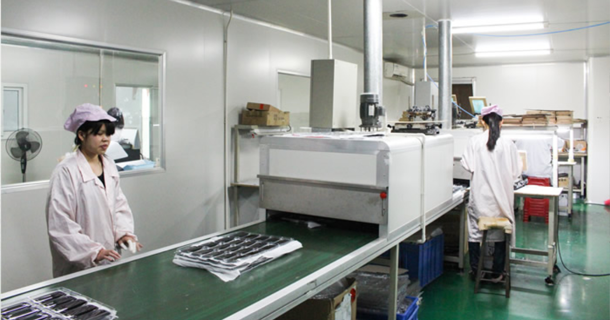 Screen printing production station at JBRplas Shenzhen — multi-colour screen printing capability for branded OEM parts