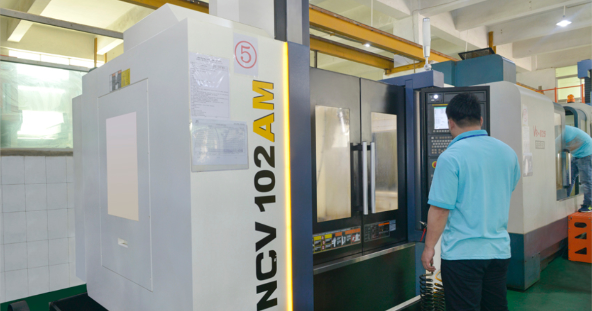 YCM high-speed CNC machining center in operation at JBRplas Shenzhen toolroom — precision mold component manufacturing