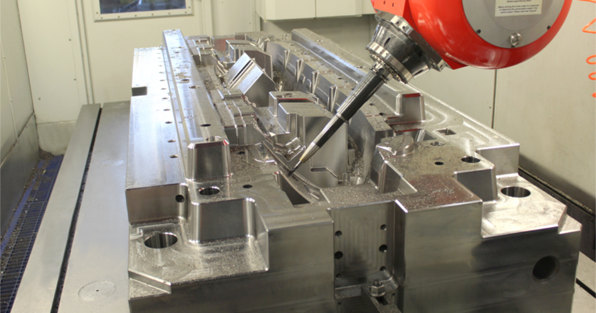 CNC machining center cutting an injection mold cavity insert — high-speed 3-axis and 5-axis CNC with ±0.005mm precision at JBRplas Shenzhen