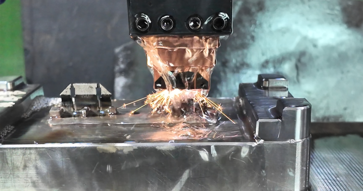 EDM sinker machine burning mold cavity detail — achieving Ra 0.2μm surface finish at JBRplas Shenzhen toolroom
