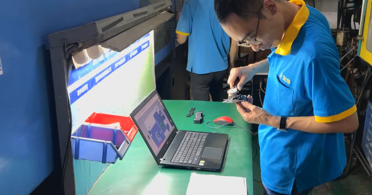 First-off dimensional inspection of an injection molded part — full dimensional report against drawing tolerances at JBRplas